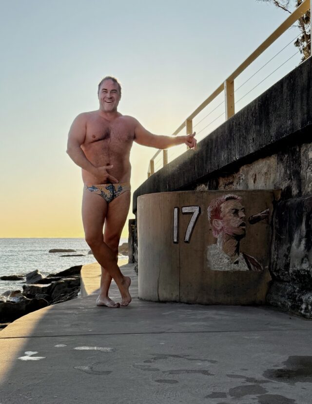 Miguel gets a photo of himself next to the temperature art work every morning