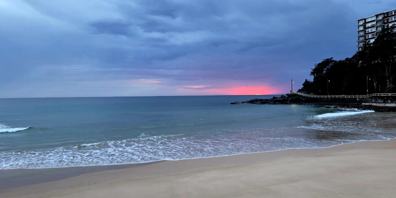Morning Reflections on a Grey Beach